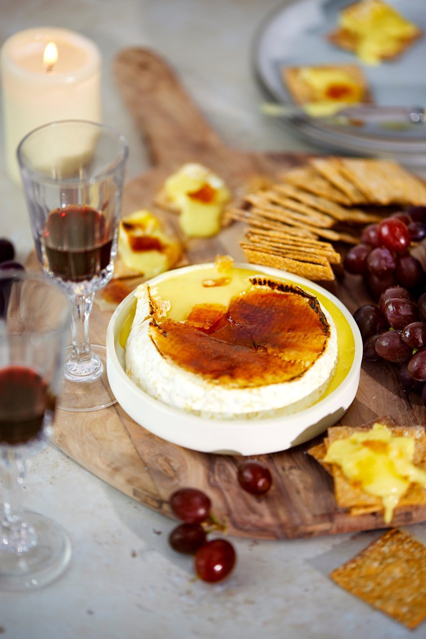 Decadent Camembert Creme Brulee served with Peters Yard Fig and Spelt Crackers, berries and red wine