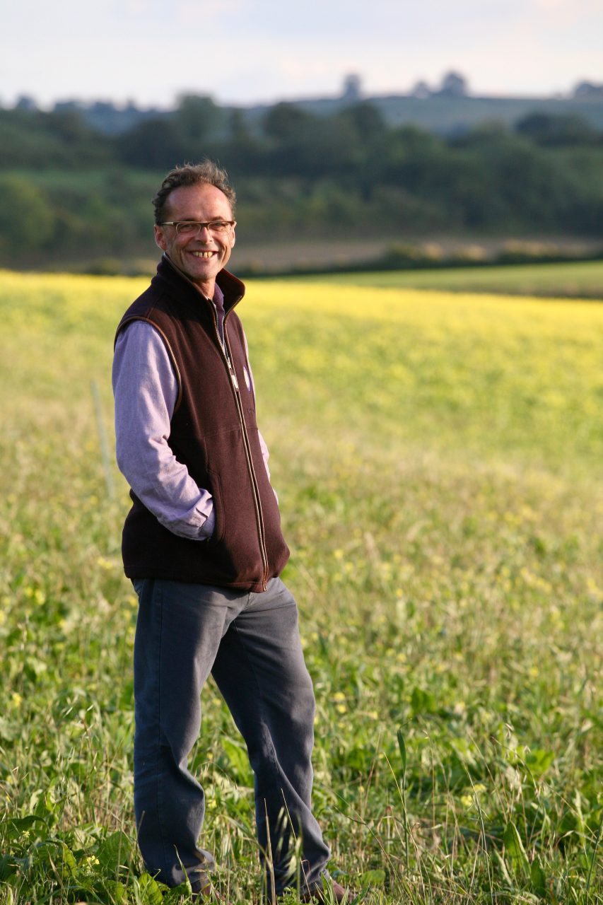 Richard Hollingbery looking over Godminster Farm